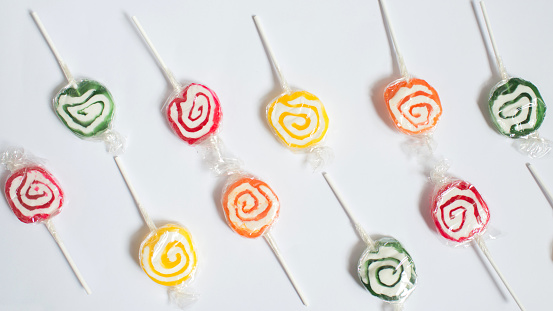 Colorful pattern with lollipops and white background