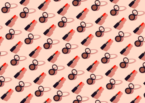 istock Creative pattern made of red lipsticks and eyeshadows on pastel background. Cosmetic and makeup concept. Beauty and fashion theme. Top view. Flat lay 1315027775
