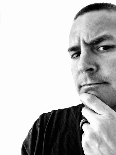 istock Man in a thinking pose in black and white 1315029003