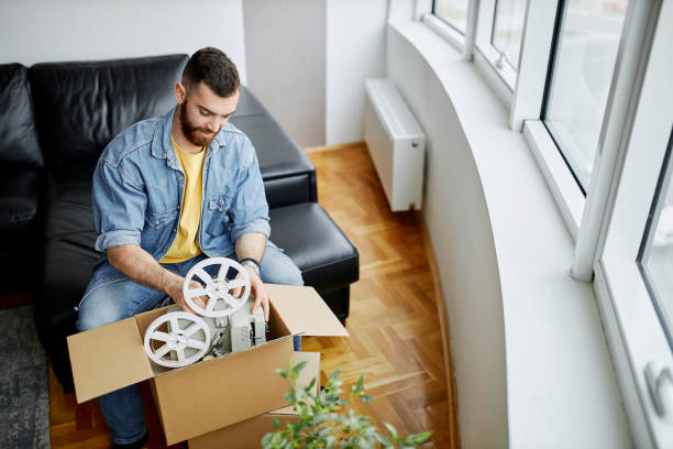 istock A man is packing and unpacking as he is moving into a new house 1315030044