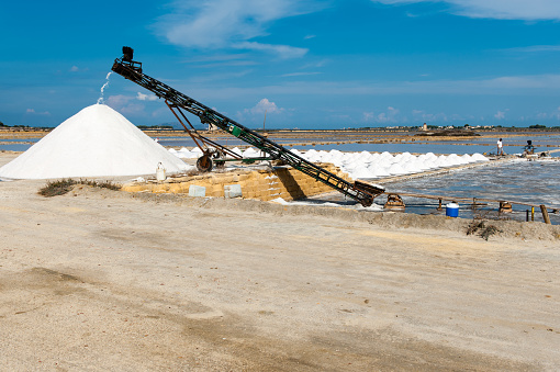 Production of sea salt in the salt evaporation ponds between Trapani and Marsala on Sicily.