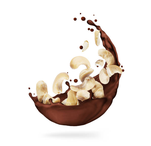 istock Chocolate splashes with crushed cashew close-up on a white background 1315030338