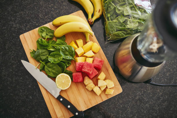 istock High angle shot of freshly cut fruit and a blender on a kitchen counter 1315030348