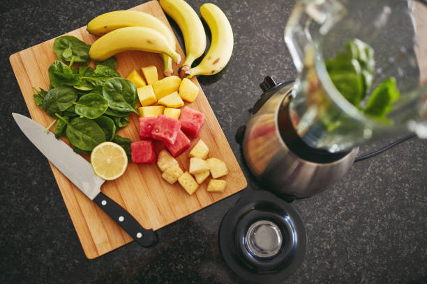 istock High angle shot of freshly cut fruit and a blender on a kitchen counter 1315030350