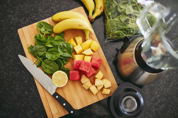 istock High angle shot of freshly cut fruit and a blender on a kitchen counter 1315030353
