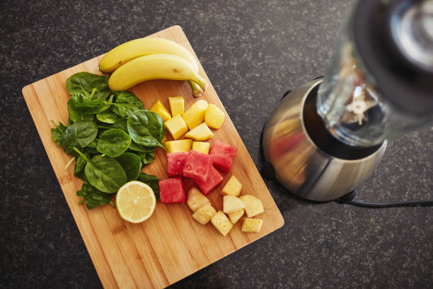 istock High angle shot of freshly cut fruit and a blender on a kitchen counter 1315030446