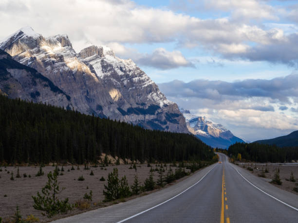 istock low angle view of a road the mountains with clouds in autumn 1315031466