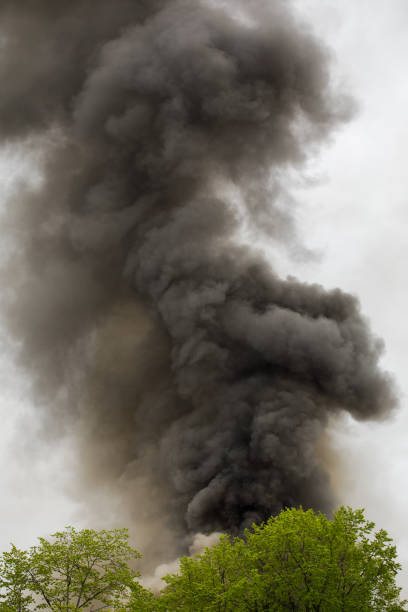 istock black smoke trail of burning house 1315032588