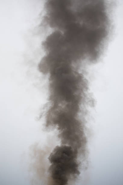 istock black smoke trail of burning house 1315032602
