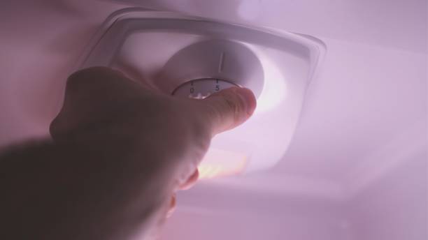 istock Adjusting Fridge Thermostat using a Selector Knob Inside of the Cooling Chamber 1315032708