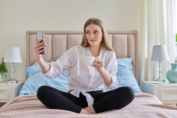 istock Happy talking young woman using video communication on smartphone 1315034630