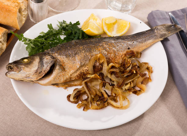 istock Oven baked sea bass fish 1315035304