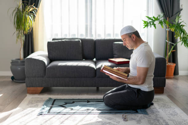 istock Muslim reading Quran to Ramadan at home 1315036077