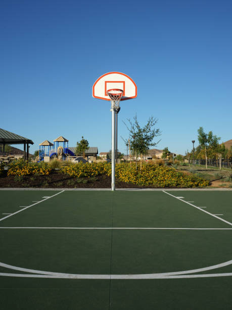 istock Basketball goal as seen from half court 1315036744