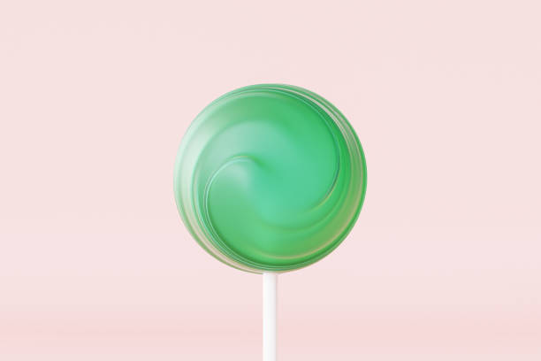 istock Green lollipop sweet candy on stick, pastel pink background, 3d rendering 1315038395