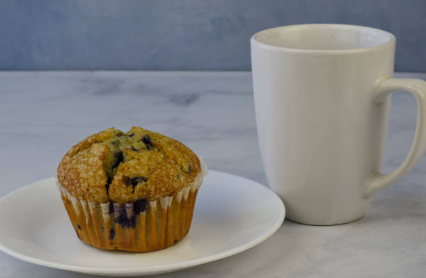istock blue berry muffin and cup of coffee 1315038589