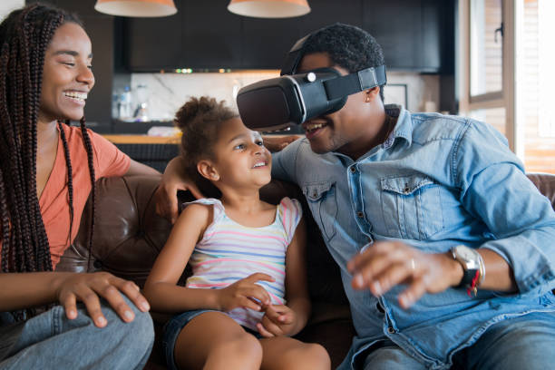 istock Family playing video games with VR glasses. 1315039452