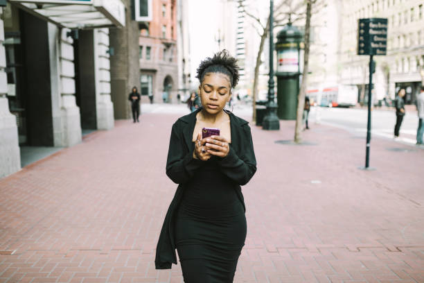 istock Confident woman walking down the street 1315040227
