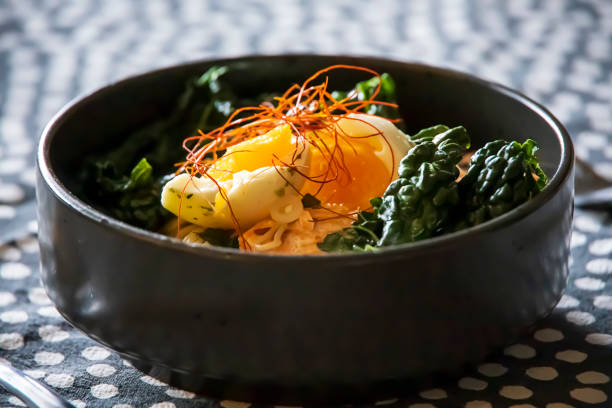 istock Egg on top of kale and ramen noodles 1315042316