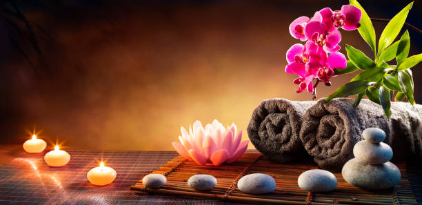 Spa Massage Treatment With Towels And Candles On Mat