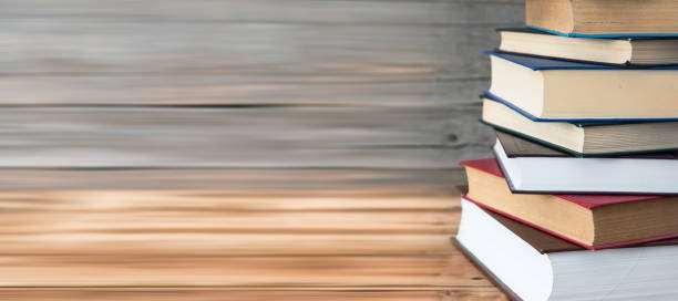 istock A pile of books on wooden table 1315047192
