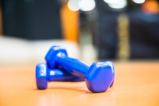 two blue dumbbell weight for fitness