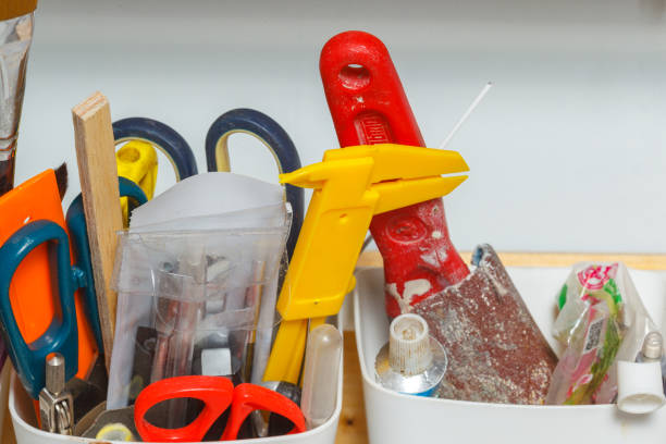 Tools in the workshop on the shelf close-up, scissors, spatula, sandpaper. horizontal frame. stock photo