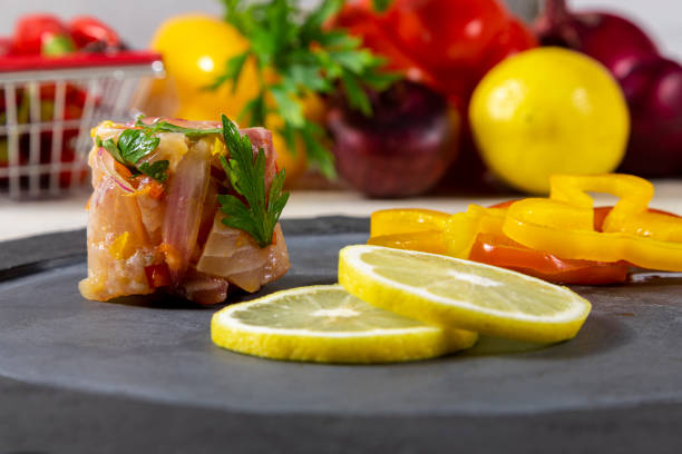 istock Peruvian ceviche is a traditional dish consumed in Peru. The preparation method is different from other places, using lemon, fish, potatoes, onion, seaweed, corn, chili, ginger, milk, sweet potato 1315049502