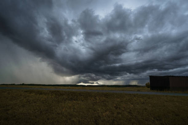 istock clouds over lone barn on dry meadow during thunderstorm and rain in summer 1315055734