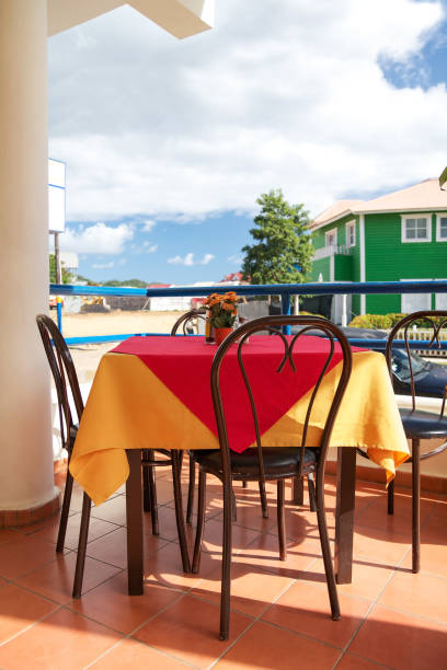 istock Typical caribbean restaurant with table and chairs outside 1315055962