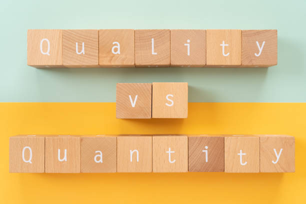 istock Quality vs quantity; Wooden blocks with 