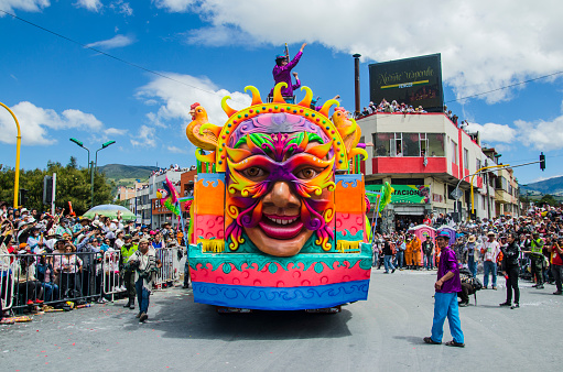 Pasto, Nariño, Colombia. January 6, 2015: floats transported on top of trucks or trailers, in which groups made up of tourists or pastusos who pay a right of way to participate in them, wear a costume that identifies each float. These huge rolling constructions are characterized by large articulated and moving cartoon or allegorical figures.