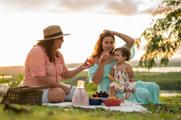 istock Family eating fruts at picnic 1315075031