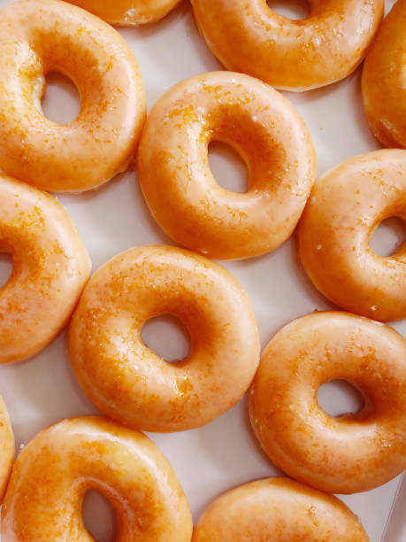 istock Golden yellow round donut coated with sugar, 1315084186