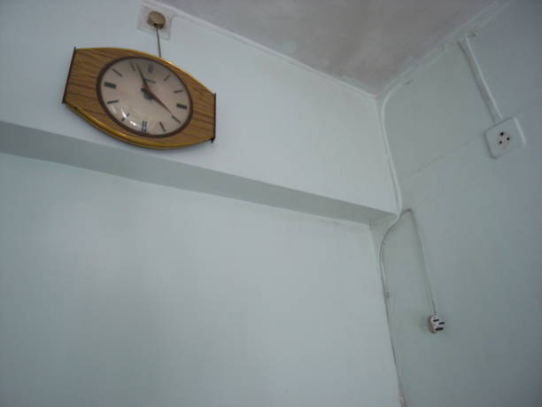istock Old Wooden Clock - Blue Wall 1315086354