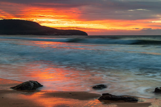 istock Sunrise at the seaside with pastel coloured clouds 1315091678