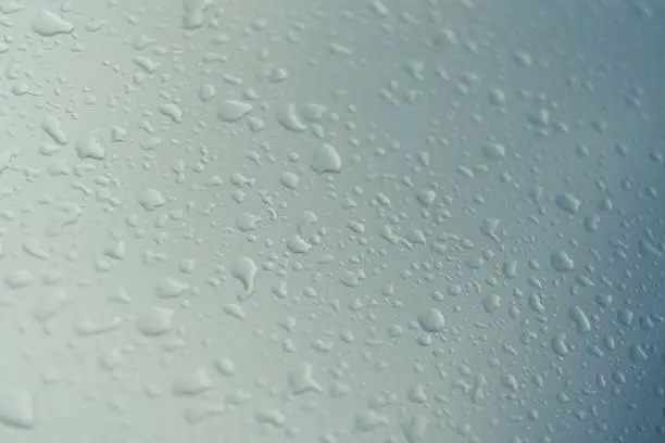 Water droplets on a blue and white background