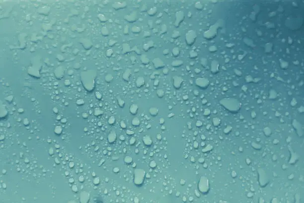 Water droplets on blue background