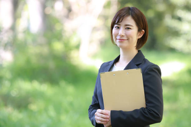 istock Female employee with binder 1315106076