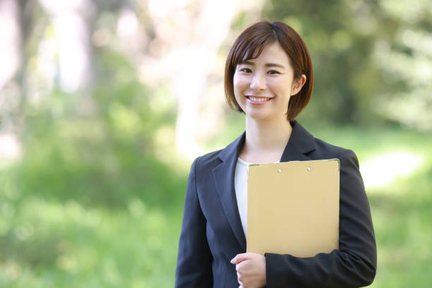istock Female employee with binder 1315106091