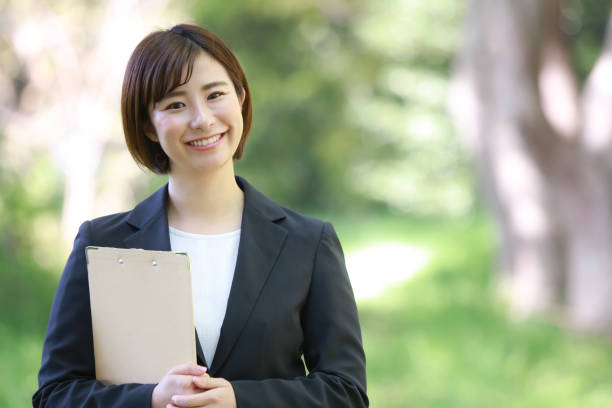 istock Female employee with binder 1315106113