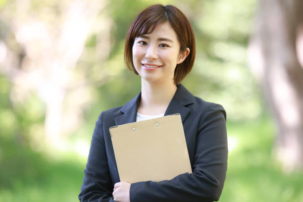istock Female employee with binder 1315106154