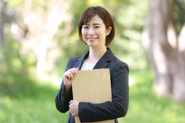 istock Female employee with binder 1315106662