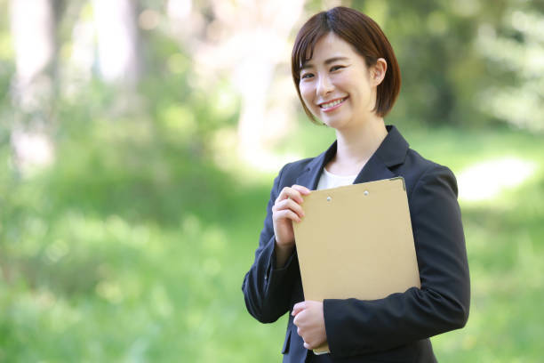 istock Female employee with binder 1315106825