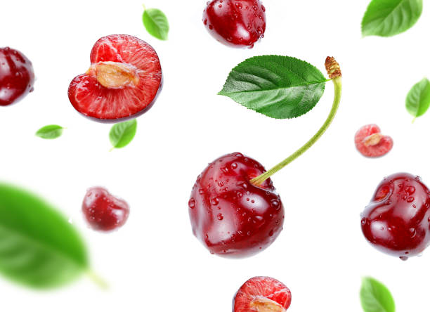 istock red cherry with water drops flying in the air stream 1315107647