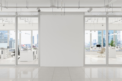Modern Open Plan Office With White Blank Wall And Cityscape Background