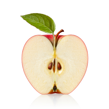 Red apple cut in half isolated on a white background.