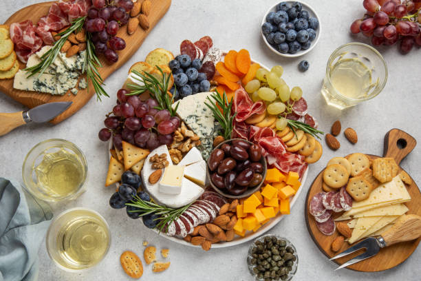 Charcuterie and cheese board. Charcuterie and cheese board. Assortment of appetizers or antipasti. Top view. olive fruit stock pictures, royalty-free photos & images