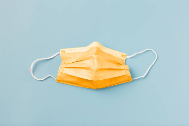 istock Medical protective mask on a blue background. 1315111860
