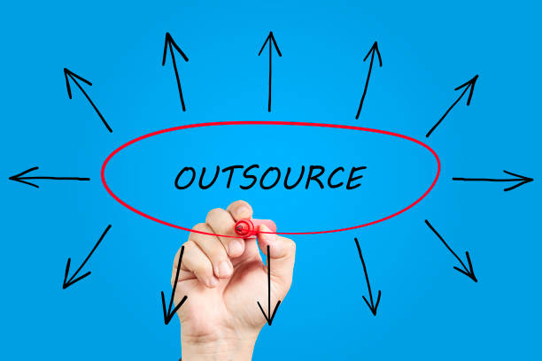 istock Hand drawing Outsourcing concept with red marker on transparent wipe board. 1315114038